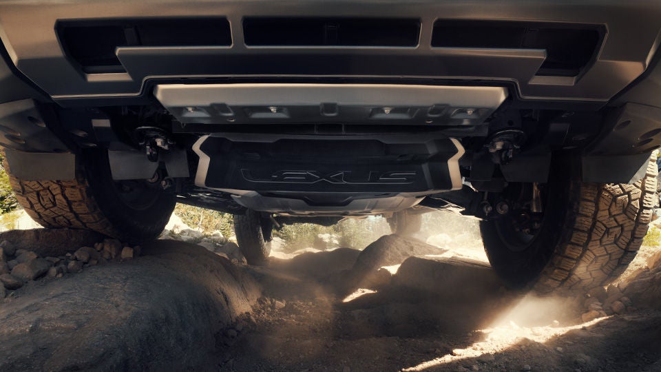An undercarriage shot of the GX Overtrail on a boulder-strewn trail, Lexus image