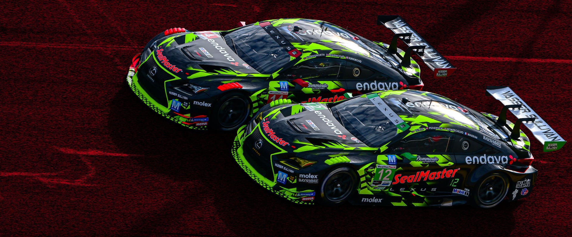 Two black and neon green Lexus race cars compete side-by-side on a vibrant red racetrack surface.