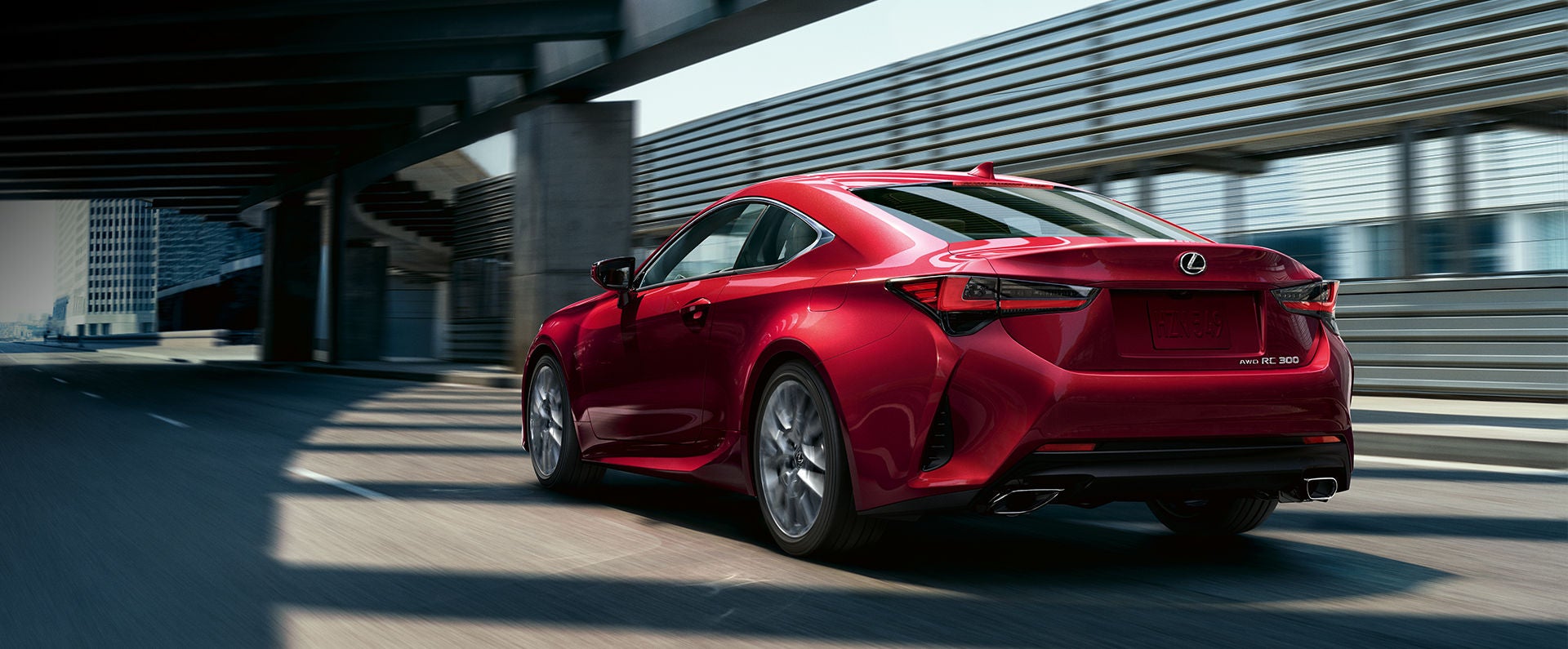 The Lexus RC driving in an urban setting.