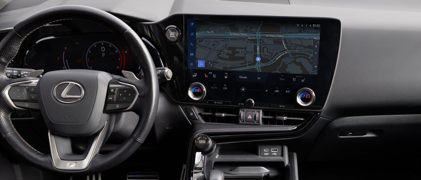 Close-up of steering wheel and dashboard controls.