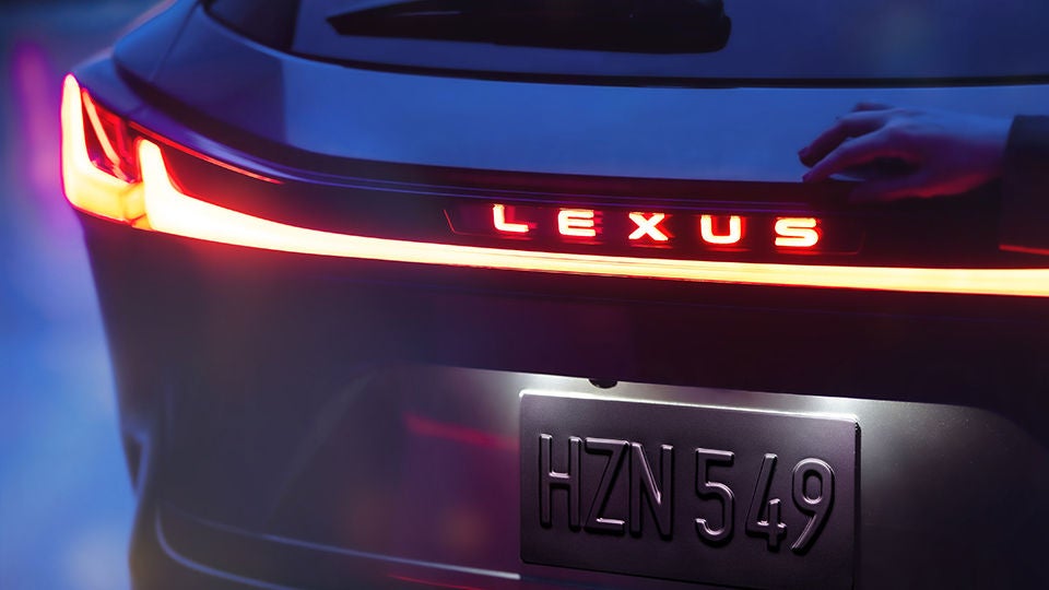 Rear of NX shown will illuminated Lexus badging and Blade Taillamp.