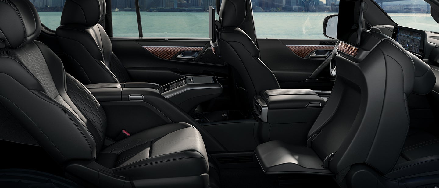 Lexus LX 700 Hybrid Ultra Luxury shown with rear-seat captain's chairs with power-retractable ottoman.