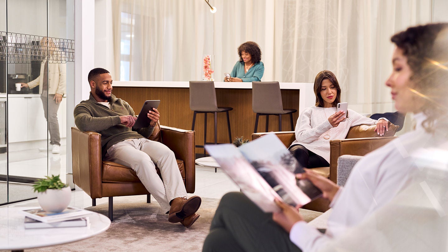 People sitting in the wi-fi lounge.