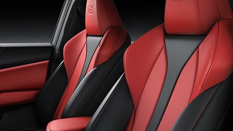 F SPORT bolstered front seats shown with Black and Circuit Red NuLuxe upholstery.