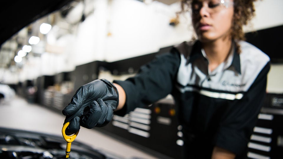 Lexus technician inspecting a vehicle.