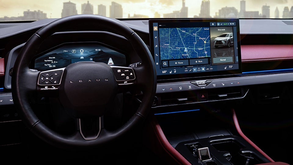 Dashboard and center console of 2027 NX shown, with backlit steering-wheel-mounted controls.